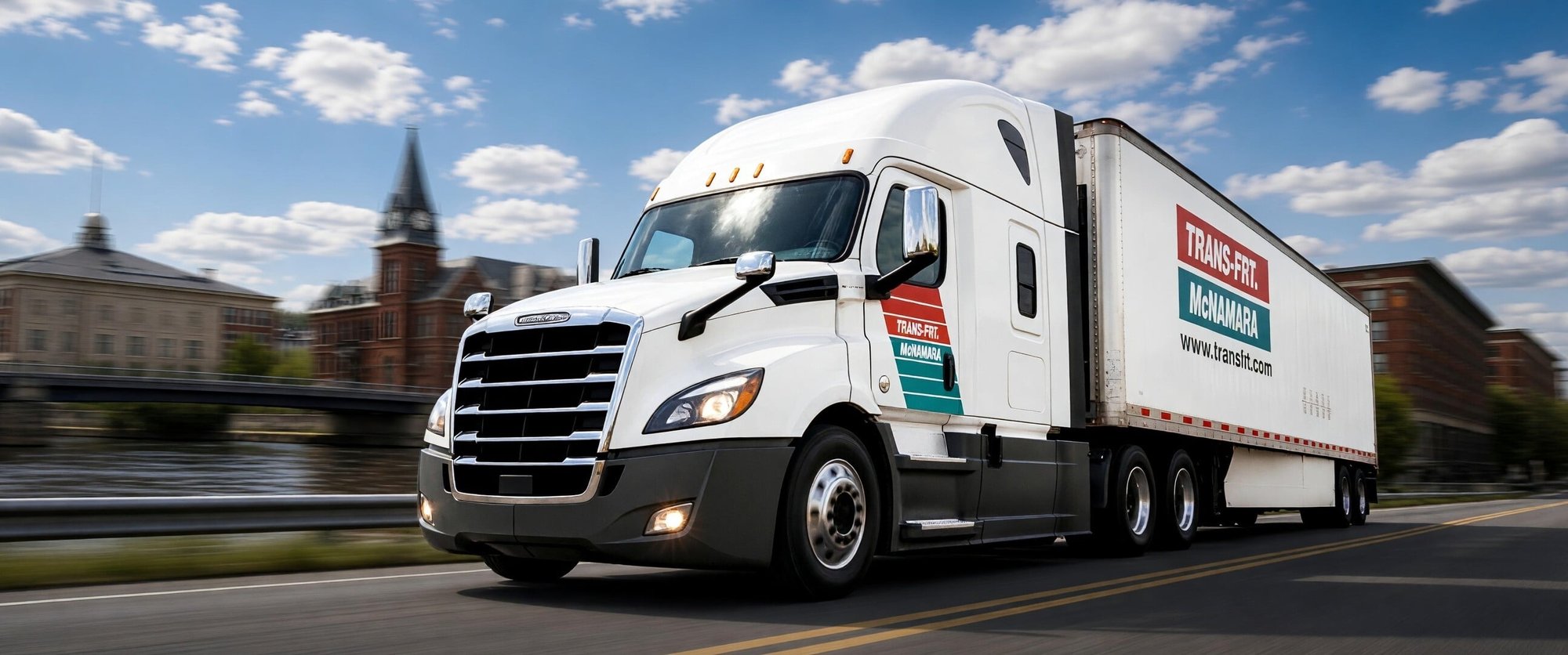 Image shows Trans-Frt McNamara semi truck driving down the highways of AYR, Ontario. Blue skies with the logo Trans-Frt McNamara on the side of the trailer and the door. Image shows Trans-Frt McNamara semi truck driving down the highways of AYR, Ontario. Blue skies with the logo Trans-Frt McNamara on the side of the trailer and the door.